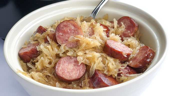 Slow cooker kielbasa and sauerkraut with sliced sausage and tender cabbage simmered together