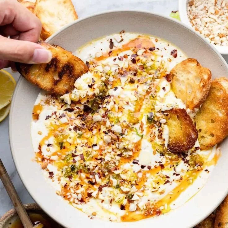 Creamy whipped feta with a drizzle of hot honey served in a bowl